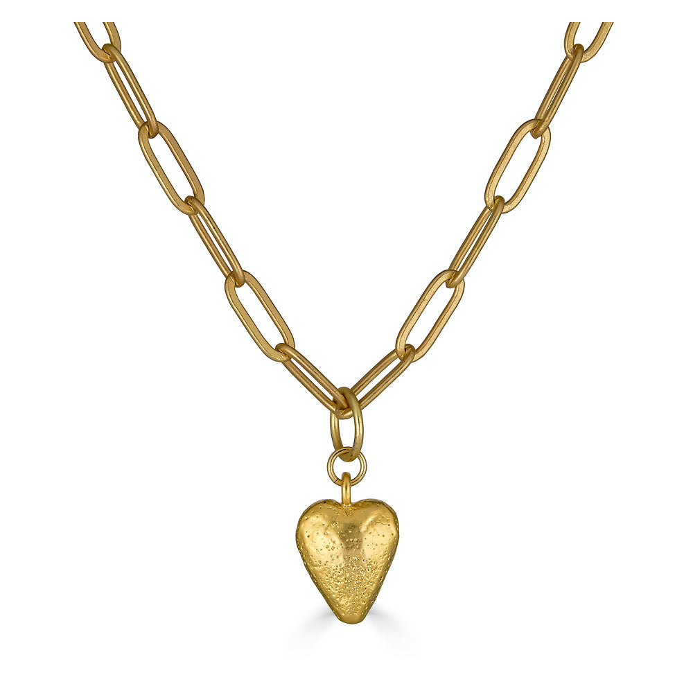 A delicate gold pendant on a paperclip chain